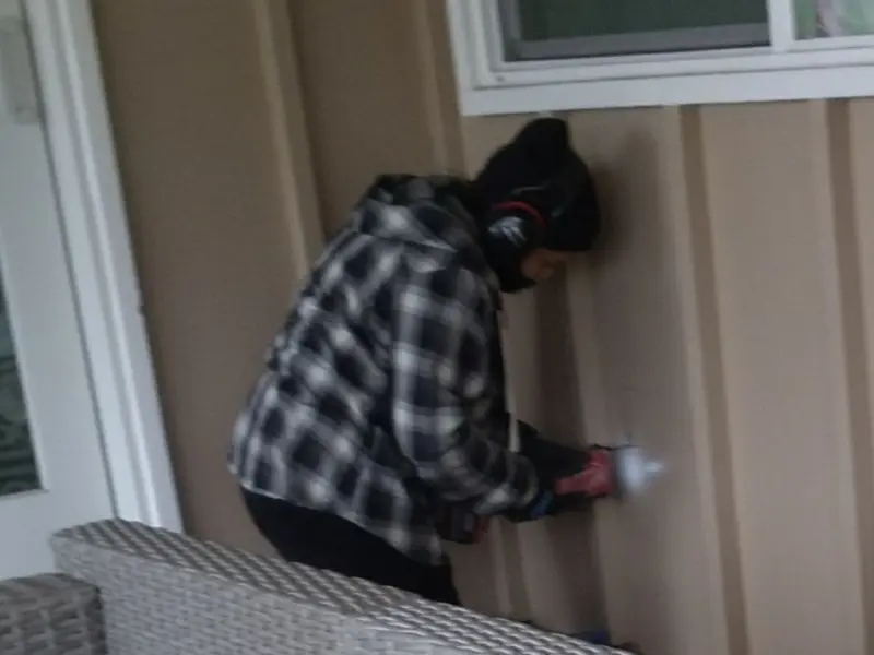 Professional electrician installing an exterior outlet in Bowdoinham