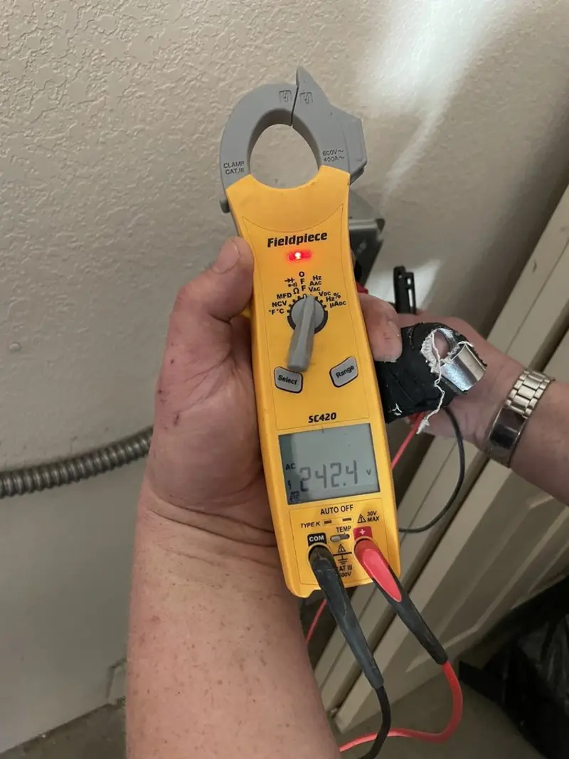 Voltage testing with clamp meter during Circuit Breaker Repair in Bowdoinham